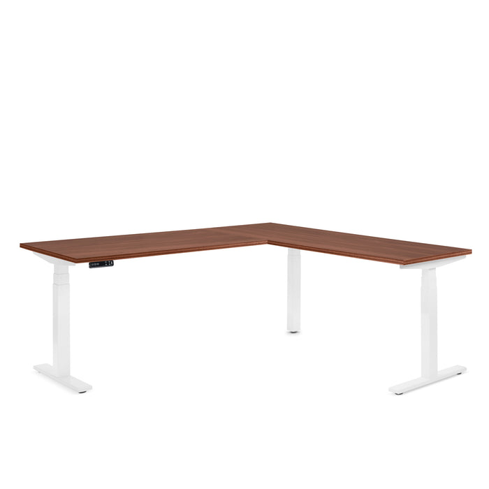 L-shaped modern desk with brown top and white legs on a white background. (Walnut)