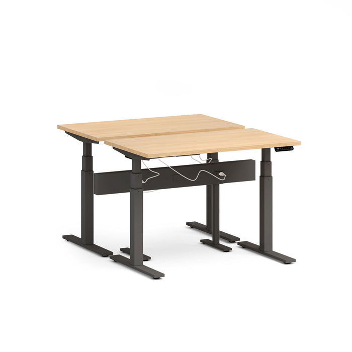 Adjustable height modern desk with wooden top and black frame on white background. (Natural Oak-47&quot;)