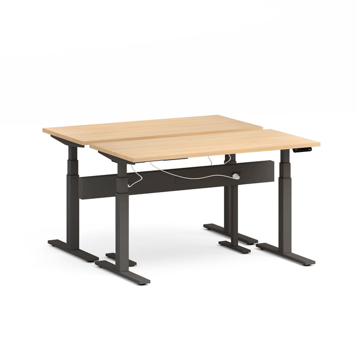 Adjustable standing desk with wood finish top and black frame on white background. (Natural Oak-57&quot;)