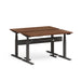 Adjustable height desk with wooden top and black frame on a white background. (Walnut-57&quot;)