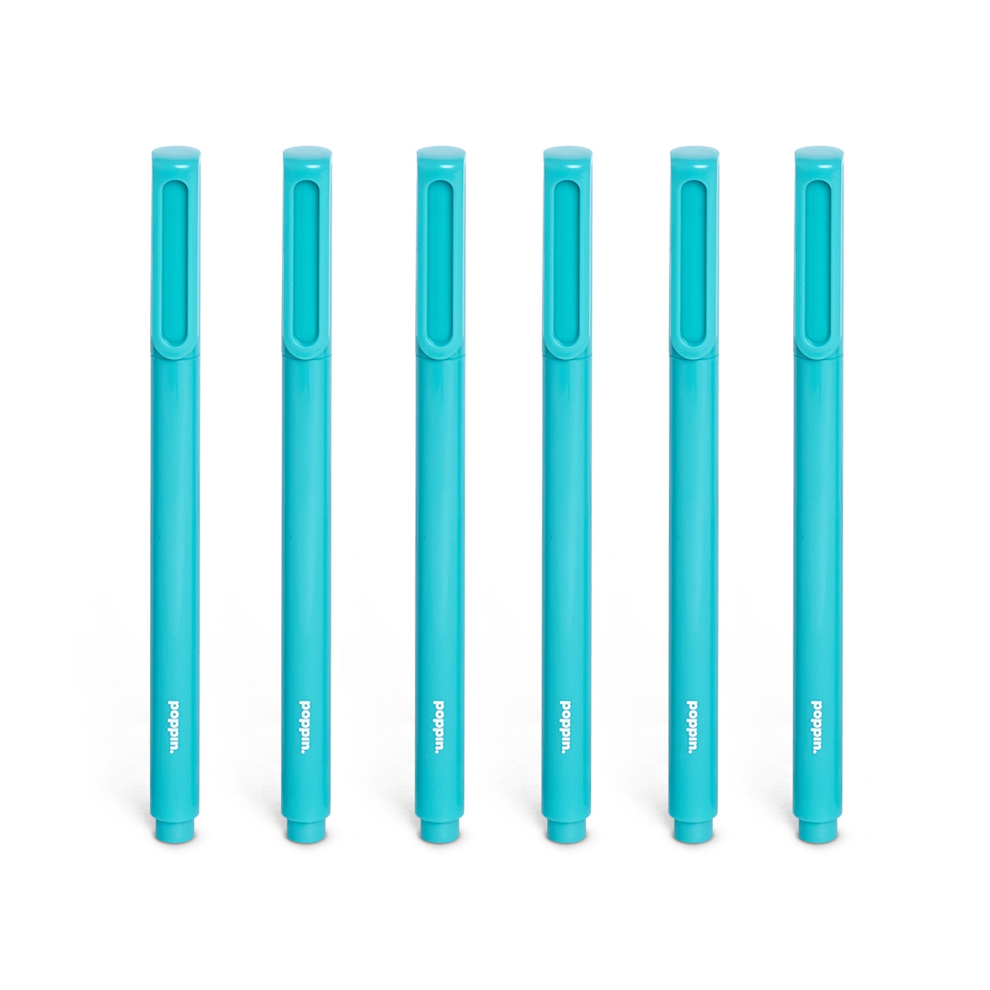 Set of six blue markers with caps on against a white background. 