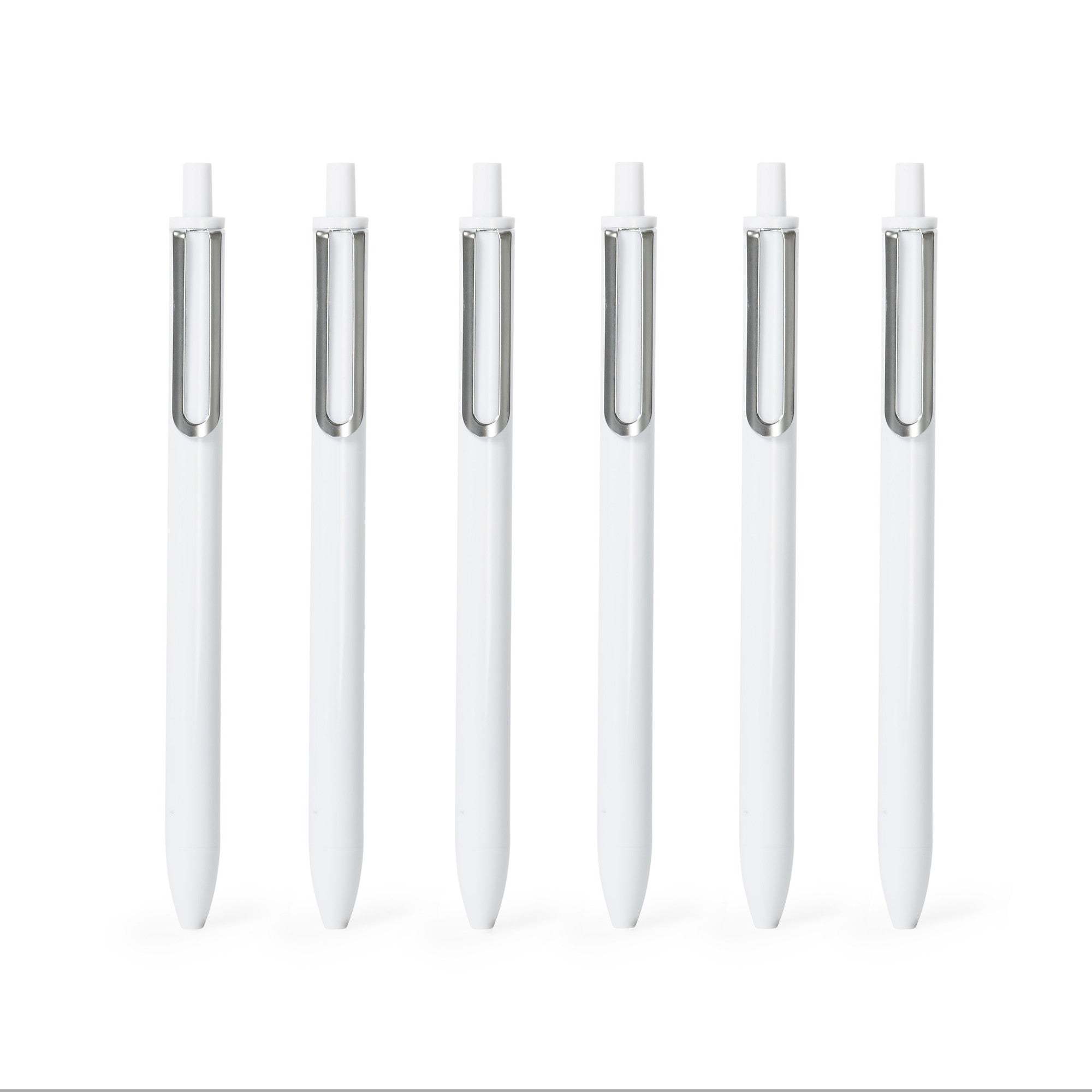 "Set of white pens with silver clips arranged in a row on a white background 