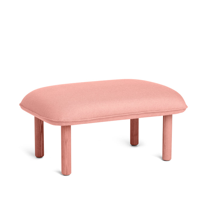 Modern pink upholstered ottoman with wooden legs isolated on a white background (Blush)