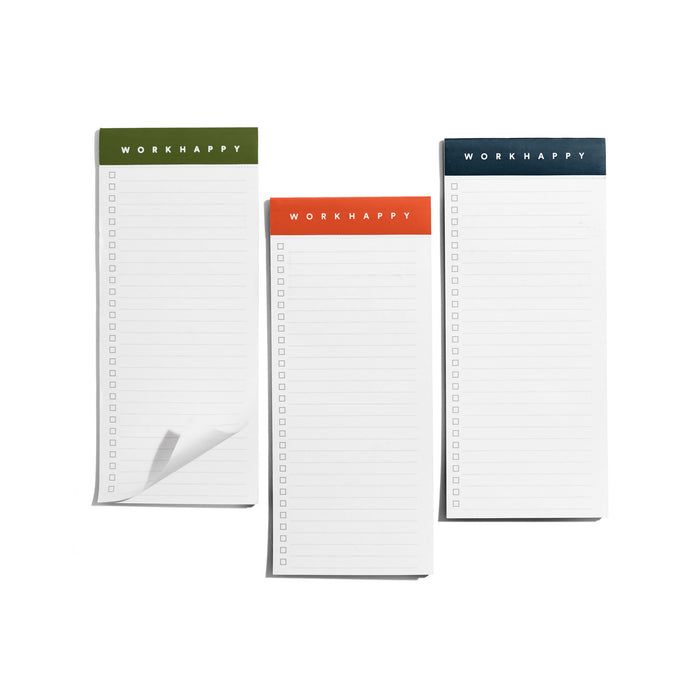 Three notepads with "WORK HAPPY" on covers isolated on white background. 