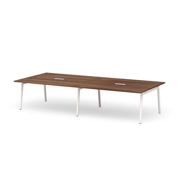 Modern walnut conference table with white legs on a plain background. (Walnut-132&quot;)