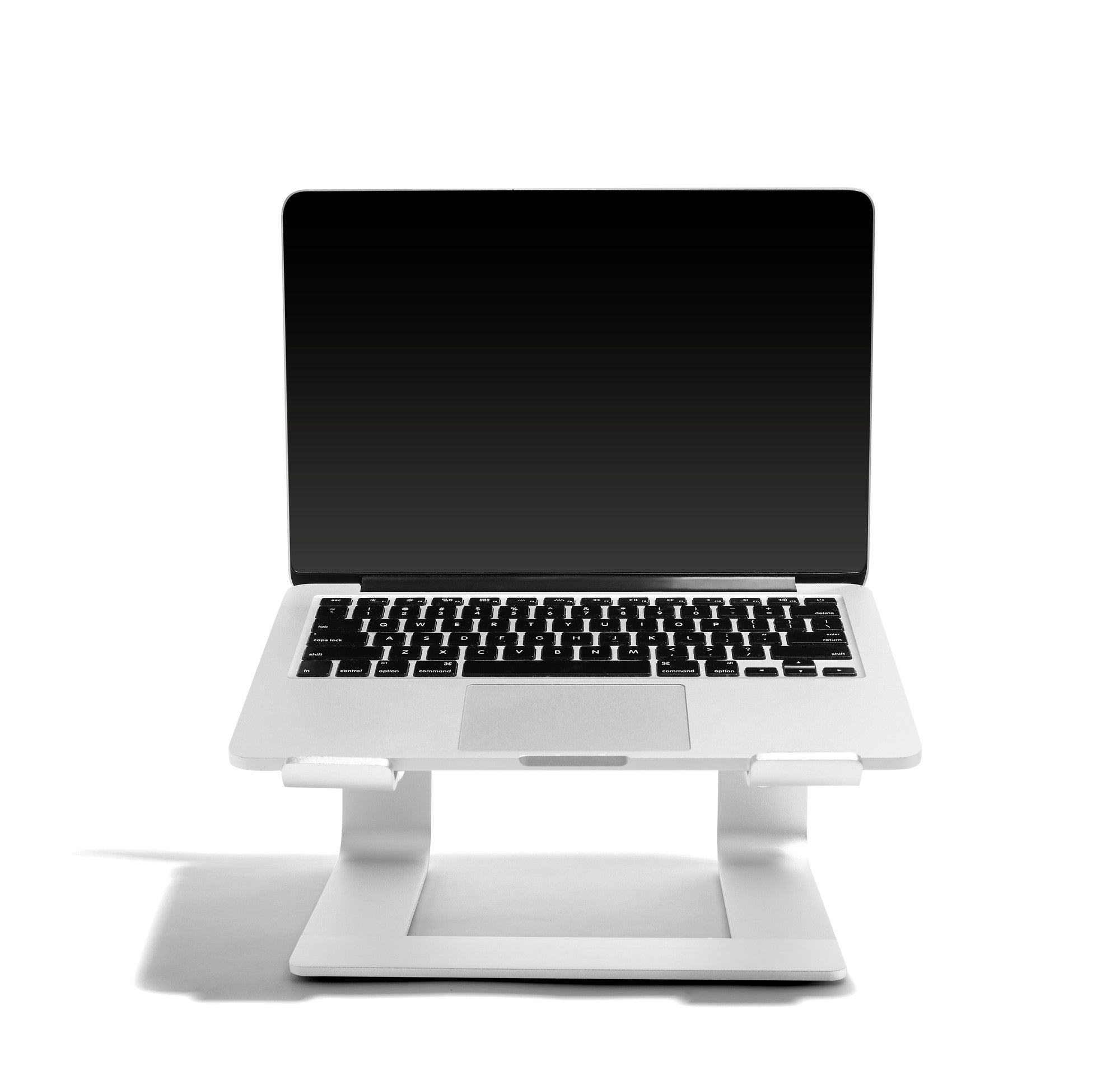Laptop on stand with blank screen on white background. 