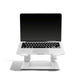 Laptop on stand with blank screen on white background. 