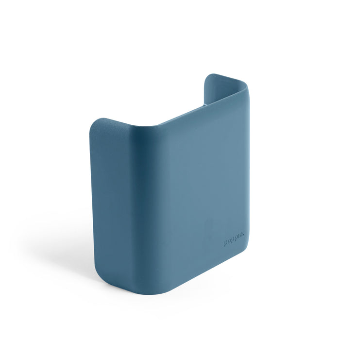 Blue silicone pocket organizer for wall mounting on a white background. (Slate Blue)