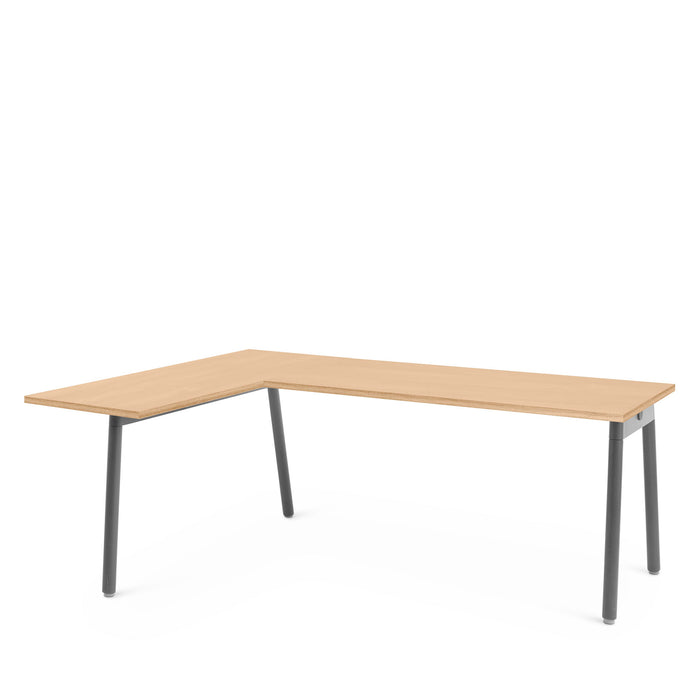 Modern L-shaped wooden desk with gray legs on a white background. (Natural Oak)